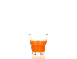 Juice pouring into glass isolated on white
