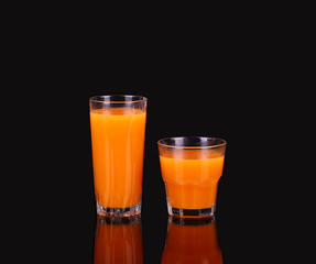 Carrots and juice in a glass