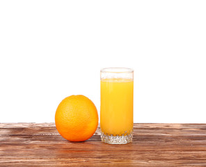 Glass of freshly pressed orange juice with sliced orange