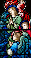 Fototapeta na wymiar Praying angels in a stained glass window