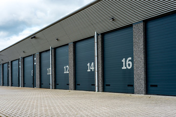 unit storage warehouse facility with numberd doors - obrazy, fototapety, plakaty