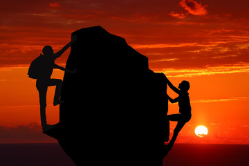 Teamwork couple hiking help each other trust assistance