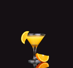 fresh organic orange juice and vodka in a tall glass 