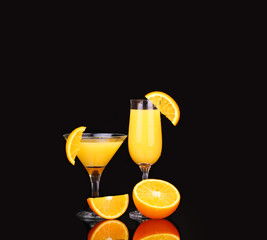 fresh organic orange juice and vodka in a tall glass  