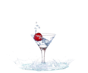 Strawberries, ice cubes into the glass