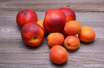 Nectarines and apricots on wooden table
