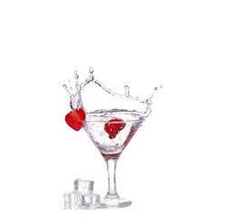 Strawberries, ice cubes into the glass