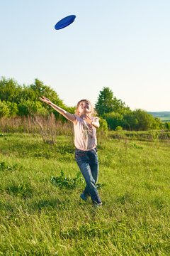 Girl playing frisbee in the park