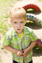 Dirty Kid Boy Portrait, Sad Child plying outdoor at playground