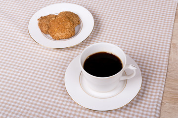 Coffee cup with cookie