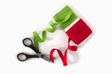 Green and red tapes with scissors