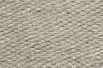 Rough beige camel wool fabric texture.