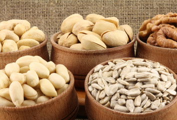 Abstract view of the mixture of nuts in a round wooden form