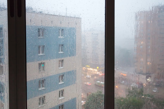 rain running down window panes