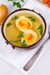 Broth with eggs and parsley