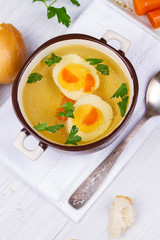 Broth with eggs and parsley