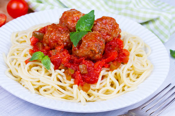 Spaghetti with meatballs in tomato sauce