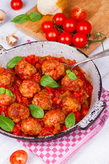 Meatballs with tomato sauce in a pan
