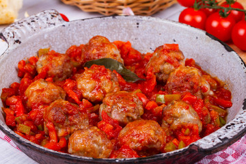 Meatballs with tomato sauce in a pan