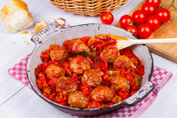 Meatballs with tomato sauce in a pan