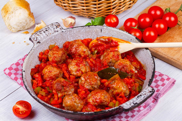 Meatballs with tomato sauce in a pan