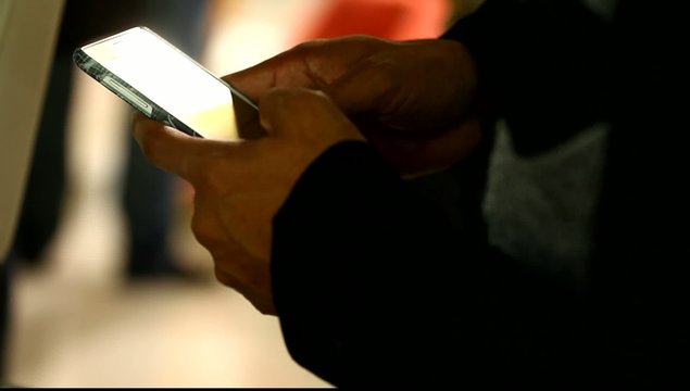Male hands with cell phone