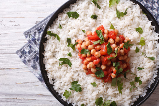 Rice with chickpea and parsley close-up. Horizontal top view
