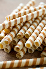 waffle rolls on wooden surface