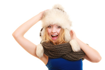 Winter fashion. Happy young woman in fur hat.