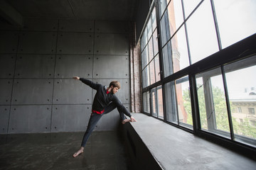 Portrait of young man doing physical exercise