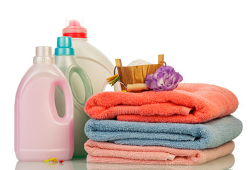 Obraz na płótnie Canvas Detergent in bottles and towels