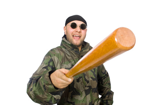 Young man in soldier uniform holding bludgeon isolated on white