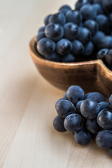 Grapes in a heart shape wooden plate