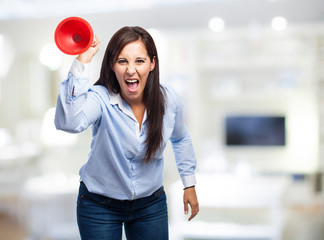 angry woman holding a plunger