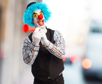 portrait of a funny clown with a whistle