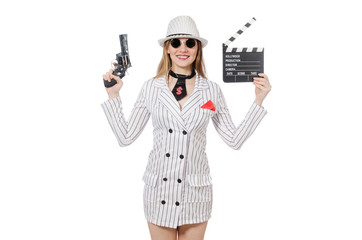 Beautiful girl holding hand gun and clapperboard isolated on whi