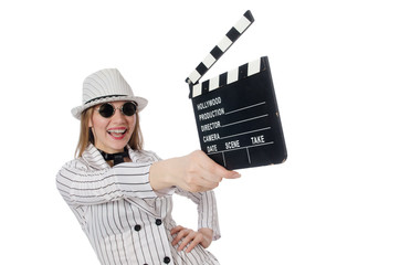 Beautiful girl in striped clothing holding clapperboard isolated