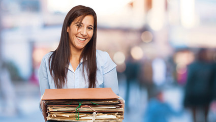 happy young woman holding files