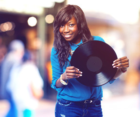 business black woman holding a vinyl