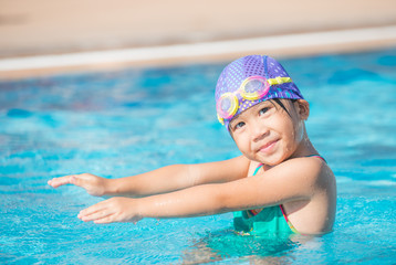 Little cute Asian girl on bikini suit