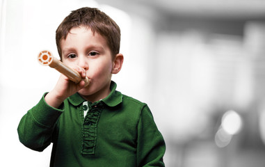 little kid playing flute © asierromero