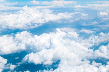 Naklejka na ściany i meble Aerial view of Blue sky and Cloud Top view from airplane window,