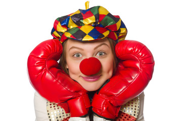 Pretty female clown with box gloves isolated on white