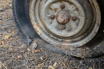 Detail Shot of a Flat Tire on a Car Selection Focus on Tire