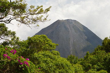 The perfect cone of the active and young Izalco volcano in El Salvador. Central America - obrazy, fototapety, plakaty