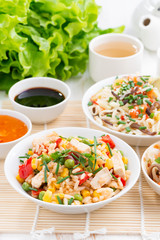 Asian food - fried rice with tofu, noodles with vegetables 