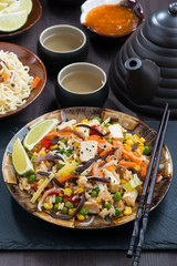 asian lunch - fried rice with tofu and vegetables, vertical