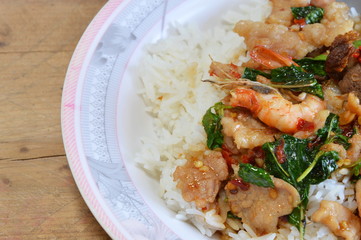 spicy fried stir basil leaf with shrimp and pork on rice