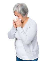 Senior woman sneeze