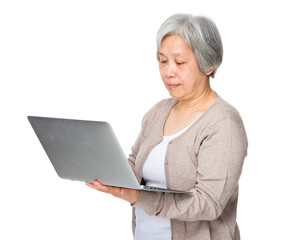 Elderly woman use of laptop computer